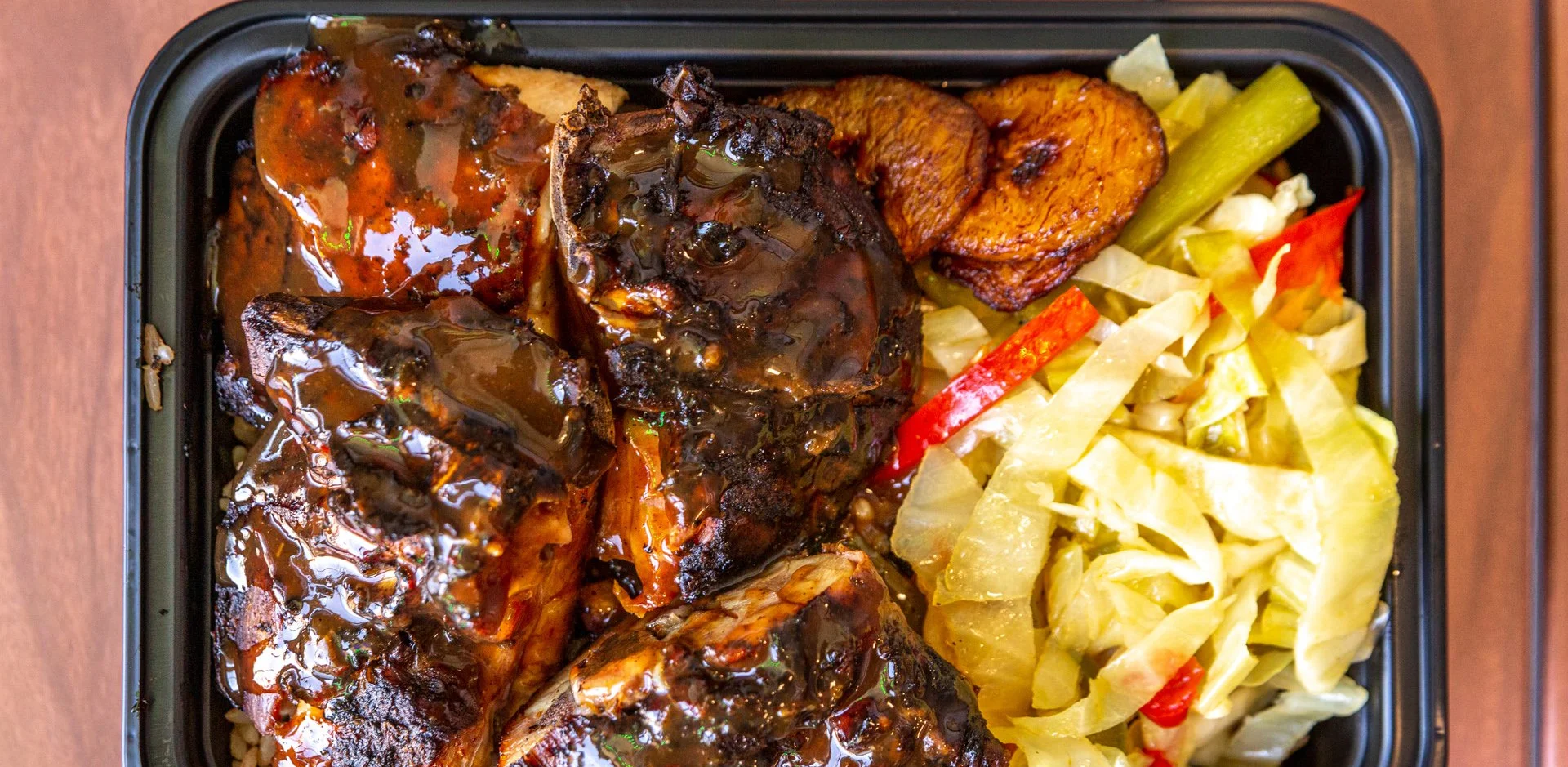 Jerk chicken plate with rice and plantains
